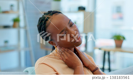 Home, neck pain and black woman on sofa massage for stress, muscle cramp and injury in living room. Medical accident, burnout and overworked person shoulders for inflammation, strain and tendinitis Home, neck pain and black woman on sofa massage for stress, muscle cramp and injury in living room. Medical accident, burnout and overworked person shoulders for inflammation, strain and tendinitis 138183561