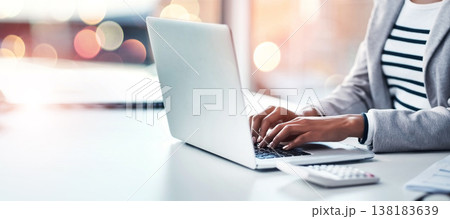 Hands, laptop and a business woman typing on double exposure space in an office while working on a research report. Computer, mockup and flare with a professional employee closeup at a workplace desk 138183639