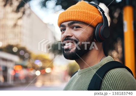 Smile, music headphones and man in city outdoor, listening to audio or sound track on internet to travel. Radio, streaming podcast and happy person hearing media online, freedom or thinking in street Smile, music headphones and man in city outdoor, listening to audio or sound track on internet to travel. Radio, streaming podcast and happy person hearing media online, freedom or thinking in street 138183740
