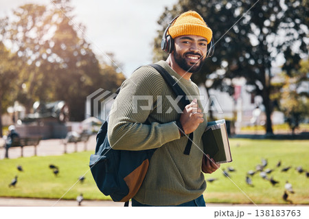 Student, headphones and backpack for outdoor education, college or university podcast in park or campus. Portrait of african man walking, travel and books with study, learning and listening to music Student, headphones and backpack for outdoor education, college or university podcast in park or campus. Portrait of african man walking, travel and books with study, learning and listening to music 138183763