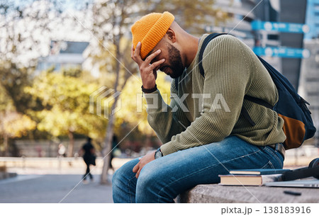 Stress, headache and student outdoor in college, campus or city with anxiety, crisis or problem in education. Frustrated, man or depressed in university with mistake, fail or fatigue from studying 138183916