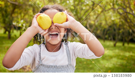 Lemon on eyes, happy and girl on farm for harvest, sustainable farming and growth in nature. Agriculture, childhood and kid smile with fruit for nutrition, healthy eating and organic food in garden 138183980
