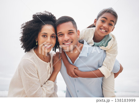 Family, portrait and beach for vacation, holiday and quality time for adventure, fun and bonding together. Happiness, piggy back, parents and smile for trip, love and outdoor to enjoy, play and break 138183999