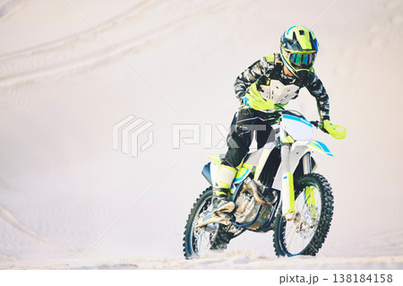 Driving, motorbike and man on sand for sport, adventure or competition outdoor in summer or mockup space. Motorcycle, ride and athlete on dirt, dune or desert for race, danger and fearless challenge 138184158