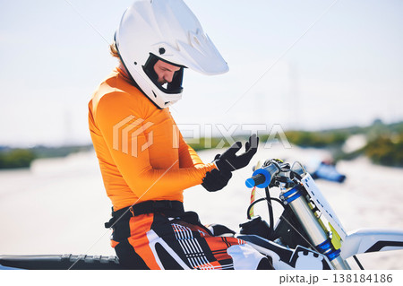 Motorbike, safety gear and ready for race in desert, training and practice for challenge on sand dunes. Athlete, outdoor and adrenaline in extreme sports, fitness and competition on dirt bike 138184186