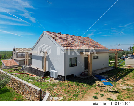 Modular modern smart automated house under construction with finished and unfinished areas, aerial view of work in progress Modular modern smart automated house under construction with finished and unfinished areas, aerial view of work in progress 138184304