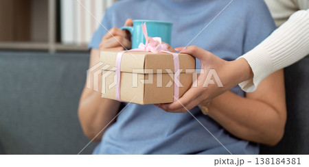 Gift exchange between mother and daughter 138184381