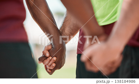 Hand, men and praying in sports group on field for training, workout or game motivation outdoor with closeup. Fitness, people or gratitude for exercise, performance or prayer with solidarity or unity 138184986