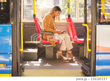 Woman in bus, sitting and typing on smartphone for social media, email and and travel on urban commute. Public transport, service and drive, girl with phone reading schedule or agenda on road to work Woman in bus, sitting and typing on smartphone for social media, email and and travel on urban commute. Public transport, service and drive, girl with phone reading schedule or agenda on road to work 138185157