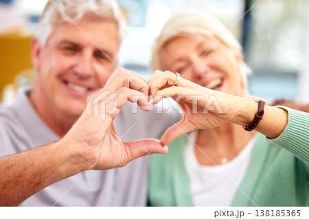 Happy couple, senior or heart hands in home for love, support or bonding in retirement together. Romance blur, hand gesture or romantic old man with a mature woman for care, commitment or trust Happy couple, senior or heart hands in home for love, support or bonding in retirement together. Romance blur, hand gesture or romantic old man with a mature woman for care, commitment or trust 138185365