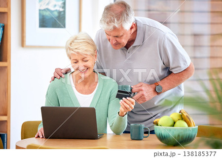 Ecommerce, mature or happy couple with laptop, credit card or discount code for digital product at home. Coffee, online shopping promo or senior people on fintech website for payment or sale search 138185377