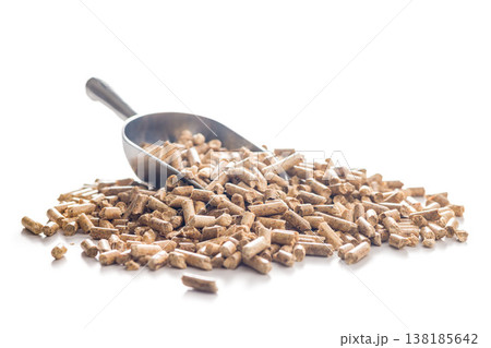 Wood Pellets With Metal Scoop Pile Biomass Fuel For Heating And Renewable Energy Applications 138185642