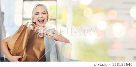 White woman, shopping and smile for purchase, bokeh and .happiness with bags, spending money and customer. Portrait, sale and mall for clothes, discount and promotion for fashion, buying and excited 138185646