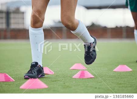 Cone, legs or athlete running in training, workout and warm up exercise on a outdoor hockey field or turf. Closeup, healthy or sports person on grass playing in a practice game for fitness speed Cone, legs or athlete running in training, workout and warm up exercise on a outdoor hockey field or turf. Closeup, healthy or sports person on grass playing in a practice game for fitness speed 138185660