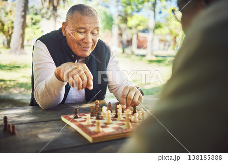 Happy, table and people in nature for chess, strategy and relax with a sport together. Smile, thinking and elderly or senior friends in retirement with games in a park on a board for competition Happy, table and people in nature for chess, strategy and relax with a sport together. Smile, thinking and elderly or senior friends in retirement with games in a park on a board for competition 138185888