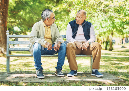 Elderly friends, relax and men on park bench, talking and bonding outdoor. Senior people sitting together in garden, communication and serious conversation in nature for retirement in the morning Elderly friends, relax and men on park bench, talking and bonding outdoor. Senior people sitting together in garden, communication and serious conversation in nature for retirement in the morning 138185900