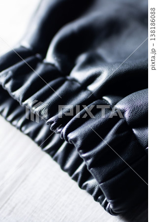Innovative leisure wear design incorporating reflective elastic cuffs and sleek sporty aesthetics 138186088