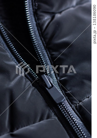 Ecommerce editorial shot highlighting textured zipper and stitching on puffer jacket Ecommerce editorial shot highlighting textured zipper and stitching on puffer jacket 138186090