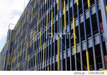 Building facade showcases bright yellow lines creating shadow patterns and rhythm Building facade showcases bright yellow lines creating shadow patterns and rhythm 138186148