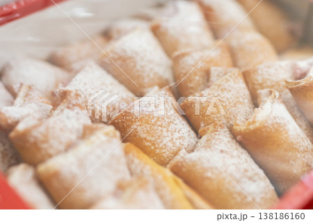 Family baking for holiday gifts. Delicate pastries with snowlike sugar and holiday warmth Family baking for holiday gifts. Delicate pastries with snowlike sugar and holiday warmth 138186160