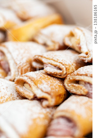 Artisan bakery offers warm sugared pastries filled with fresh fruity jam in inviting setting 138186165