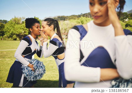Bullying, cheerleading and friends with gossip about girl, talking behind back and secret. School, psychology and students speaking about teenager with rumor, problem or conversation as cheerleaders Bullying, cheerleading and friends with gossip about girl, talking behind back and secret. School, psychology and students speaking about teenager with rumor, problem or conversation as cheerleaders 138186567