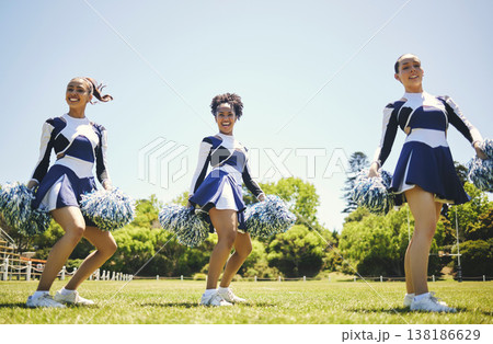 Portrait, motivation and a cheerleader group of women outdoor for a training routine or sports event. Smile, teamwork and diversity with a happy young cheer squad on a field together for support Portrait, motivation and a cheerleader group of women outdoor for a training routine or sports event. Smile, teamwork and diversity with a happy young cheer squad on a field together for support 138186629