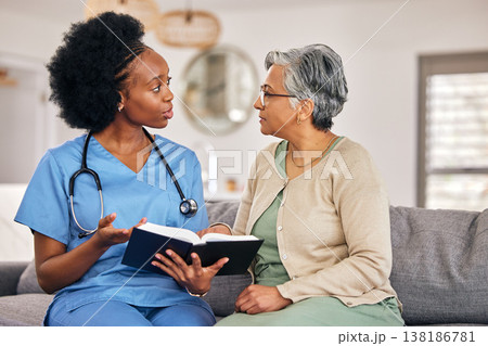 Bible, religion and assisted living caregiver with an old woman in a retirement home together. Healthcare, christian faith or belief with a nurse or volunteer reading to a senior patient in a house Bible, religion and assisted living caregiver with an old woman in a retirement home together. Healthcare, christian faith or belief with a nurse or volunteer reading to a senior patient in a house 138186781