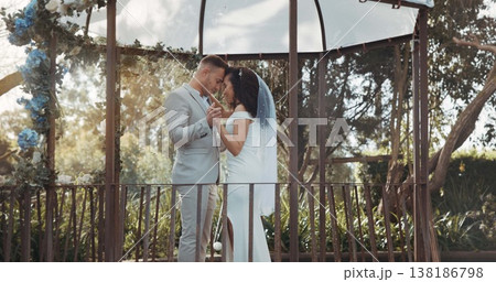 Couple, wedding and dance to celebrate marriage or commitment in garden for love, unity or dress. Happy partnership, trust or bride with groom in respect for together in gratitude, romance or support 138186798