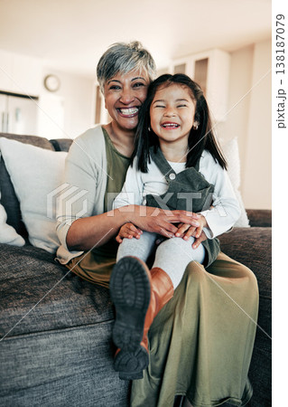 Portrait, care and grandmother with child on sofa together for bonding, connection and love in living room of home. Happy family, woman and girl on couch with happiness for relaxing, weekend and face Portrait, care and grandmother with child on sofa together for bonding, connection and love in living room of home. Happy family, woman and girl on couch with happiness for relaxing, weekend and face 138187079