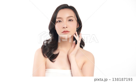 A beautiful young Asian woman with clean, fresh skin against a white background. Skincare, facial treatment, cosmetology, beauty, and spa. An elegant portrait of an Asian woman. A beautiful young Asian woman with clean, fresh skin against a white background. Skincare, facial treatment, cosmetology, beauty, and spa. An elegant portrait of an Asian woman. 138187193