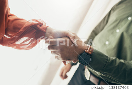 Business people, handshake and partnership in meeting, b2b deal or teamwork below at office. Low angle of man and woman shaking hands for startup, introduction or thank you in agreement at workplace 138187408