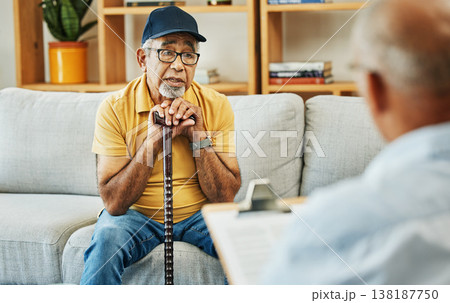 Doctor, consultation and senior man on sofa with walking stick or discussion of physical therapy and checklist. Therapist, consulting and talking to elderly patient on couch in rehabilitation office 138187750
