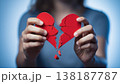Broken heart in the hands - divorce concept. photo with red heart. 138187787