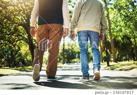 Walking, park and back of men outdoors for wellness, fresh air and health in retirement. Friends, fitness and legs of people on path in nature to relax for training, exercise and cardio workout 138187817