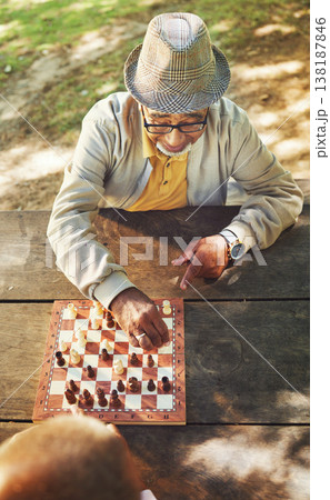 Senior men, chess and game in park, above and moving with strategy, problem solving or competition. Elderly friends, retirement and playing together for contest with king, queen and knight in summer Senior men, chess and game in park, above and moving with strategy, problem solving or competition. Elderly friends, retirement and playing together for contest with king, queen and knight in summer 138187846