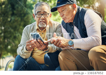 Senior men, friends and phone in park, reading and talk with memory, thinking and relax in sunshine. Elderly people, smartphone and talking on bench, nostalgia and check social media notification Senior men, friends and phone in park, reading and talk with memory, thinking and relax in sunshine. Elderly people, smartphone and talking on bench, nostalgia and check social media notification 138187852