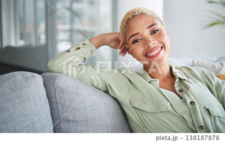 Happy, woman and portrait at home of freelancer relax with a smile on a living room couch. Female person, calm and thinking in a house with remote work break and rest on a lounge sofa with peace 138187878