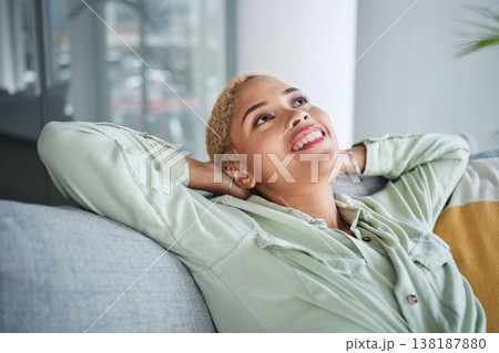 Woman, relax and living room on a couch with a smile and rest with thinking and happy memory. Home, female person and calm in a house with future dream and peace in a lounge with freelancer break Woman, relax and living room on a couch with a smile and rest with thinking and happy memory. Home, female person and calm in a house with future dream and peace in a lounge with freelancer break 138187880