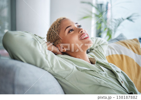 Woman, relax and living room on a sofa with a smile and rest with thinking and happy memory. Home, female person and calm in a house with future dream and peace in a lounge with freelancer break 138187882