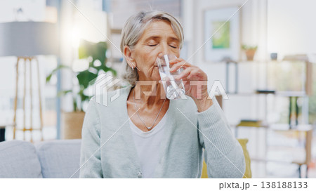 Wellness, home or healthy old woman drinking water for healthcare or natural vitamins in a house. Retirement, elderly relaxing or thirsty senior person refreshing with liquid for energy or hydration Wellness, home or healthy old woman drinking water for healthcare or natural vitamins in a house. Retirement, elderly relaxing or thirsty senior person refreshing with liquid for energy or hydration 138188133
