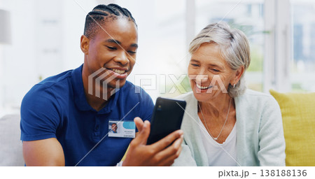 Phone, medical and a nurse talking to a patient in an assisted living facility for senior people. Healthcare, mobile and contact with a black man medicine professional chatting to a mature woman Phone, medical and a nurse talking to a patient in an assisted living facility for senior people. Healthcare, mobile and contact with a black man medicine professional chatting to a mature woman 138188136