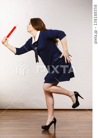 Student woman holding big pencil 138188358