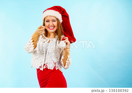 Smiling woman in christmas santa hat Smiling woman in christmas santa hat 138188392