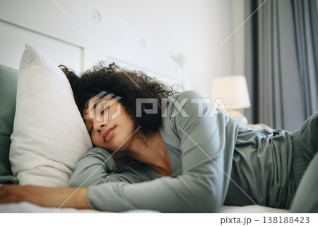 Woman, Tired and sleeping on bed in bedroom with fatigue and burnout, dream and relax for stress relief. Exhausted, person and girl in house or home lying on pillow in apartment for wellness and calm Woman, Tired and sleeping on bed in bedroom with fatigue and burnout, dream and relax for stress relief. Exhausted, person and girl in house or home lying on pillow in apartment for wellness and calm 138188423