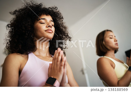 Women friends, yoga and meditate at home, zen and peace for bonding or support. Calm people, wellness and health for flexibility, care and zen fitness in living room, strong core and namaste in soul 138188569