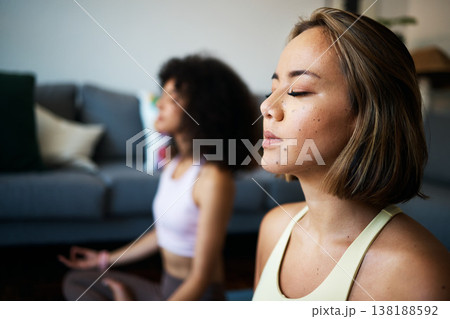 Women, fitness friends and meditation with mindfulness, wellness and peace of mind with breathing at home. Yoga, spiritual and calm in living room with healing and zen, exercise and self care Women, fitness friends and meditation with mindfulness, wellness and peace of mind with breathing at home. Yoga, spiritual and calm in living room with healing and zen, exercise and self care 138188592
