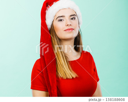Woman wearing Santa Claus helper costume Woman wearing Santa Claus helper costume 138188608