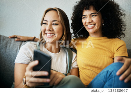 Love, smile and a lesbian couple watching tv on a sofa in the living room of their home together. Relax, LGBT and a woman with her girlfriend enjoying a movie on a subscription streaming service Love, smile and a lesbian couple watching tv on a sofa in the living room of their home together. Relax, LGBT and a woman with her girlfriend enjoying a movie on a subscription streaming service 138188667