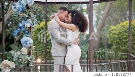 Wedding, bride and groom dancing with hug and happiness at ceremony with life partner and commitment. Marriage, trust and people in interracial relationship, event decor and nature, love and care Wedding, bride and groom dancing with hug and happiness at ceremony with life partner and commitment. Marriage, trust and people in interracial relationship, event decor and nature, love and care 138188774